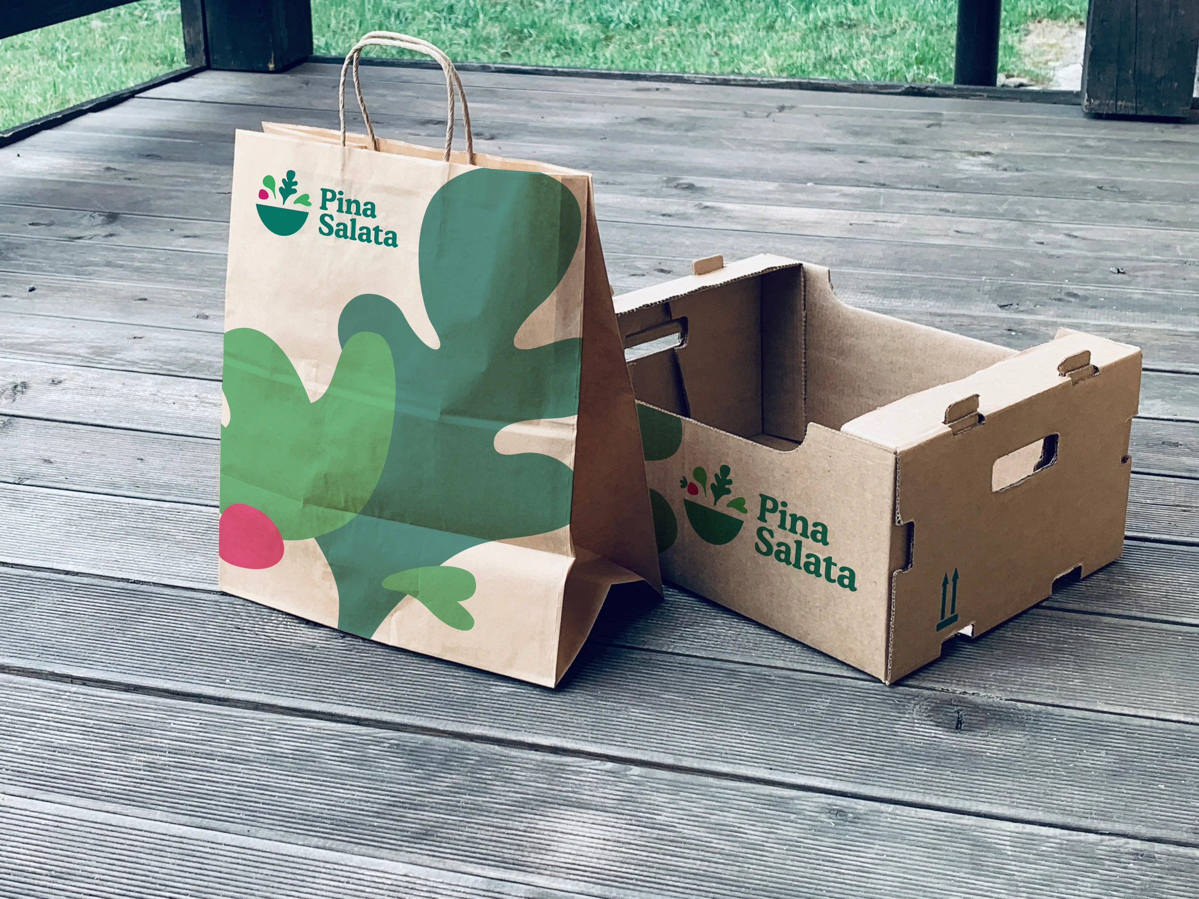 Original Pina Salata paper bag and produce box with oversized leaf graphics