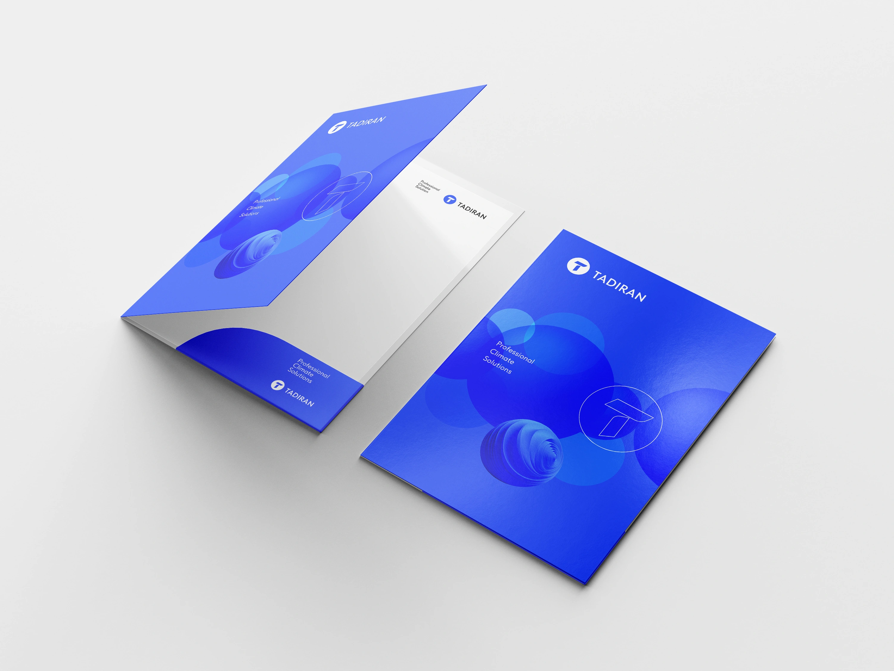 Original dimensional Tadiran folder with blue circular graphics and insert