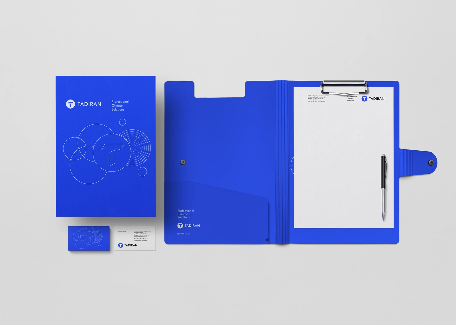 Tadiran’s circular visual language applied to a blue folder, letterhead and business cards